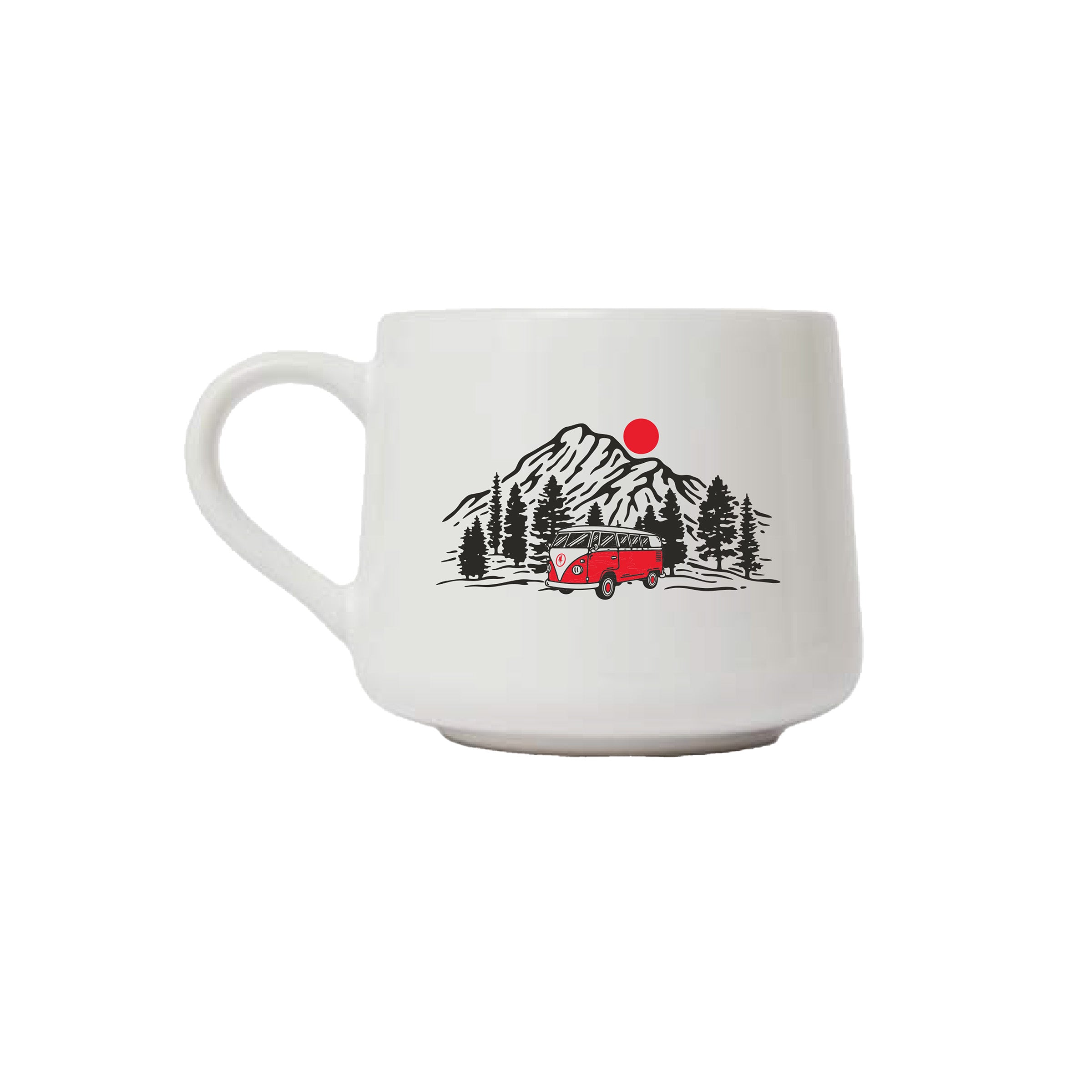 A white ceramic coffee mug featuring a retro-style illustration of a red vintage camper van parked in front of a mountain range with pine trees and a red sun.