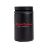 Black 8oz grip lid Nomad tumbler with red Kaladi Brothers logo