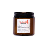 AK Cozy Co amber glass candle with Kaladi coffee label