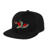 Black five-panel hat with embroidered red and green coffee cherry design