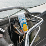 White 16oz 360 Traveler with Salmon Sisters artwork resting on boat rigging