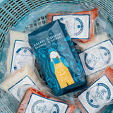 Packages of Kaladi Brothers Coffee & Salmon Sisters seafood in a blue basket