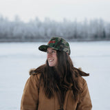Woman wearing the Kaladi camo hat in winter
