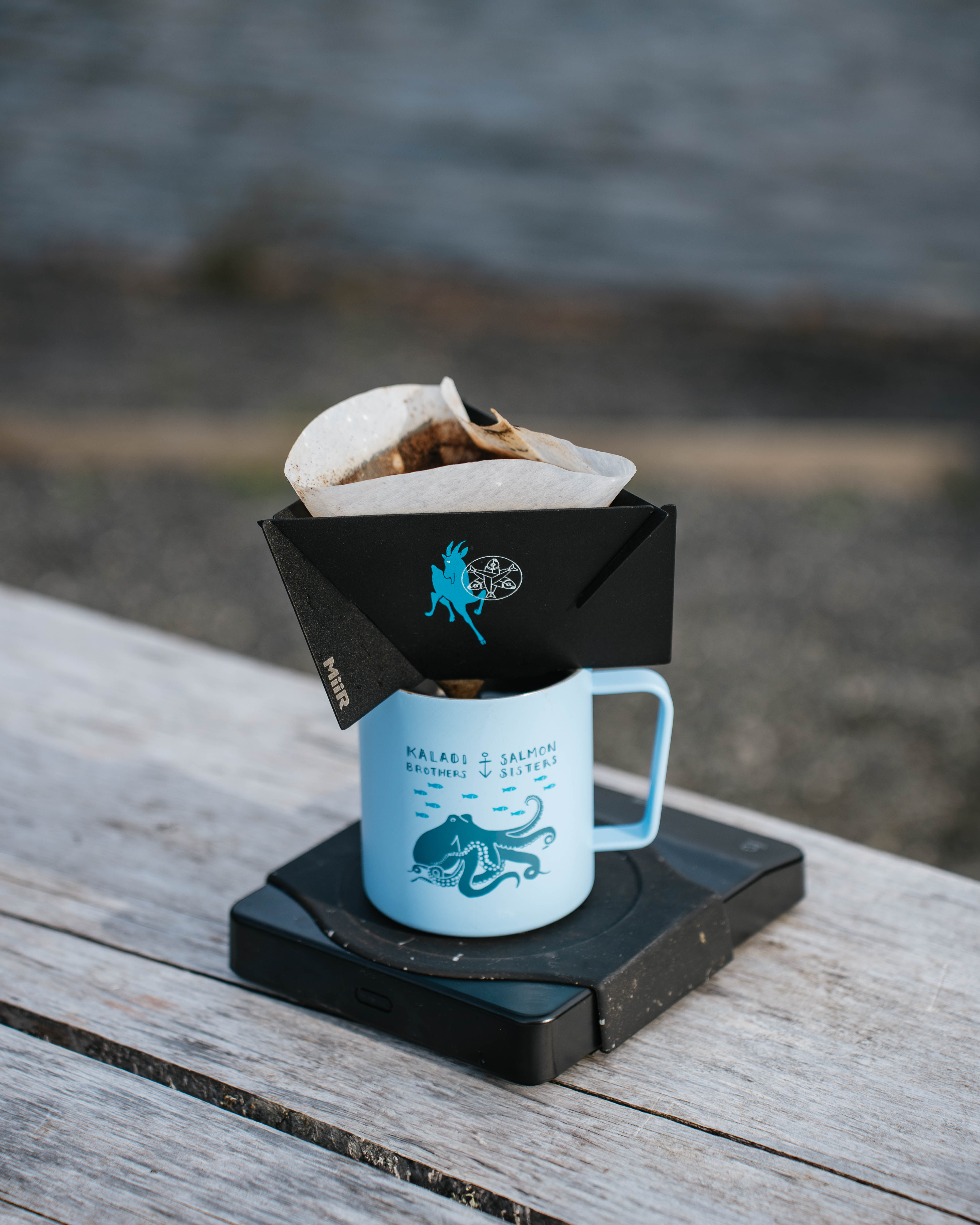 Pour-over brewing on the MiiR digital coffee scale by the water