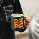 Person holding the navy Kaladi camp cup filled with a latte