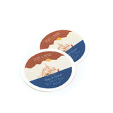 Two round Rise & Grind stickers with sailing ship artwork