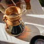 Pouring a Chemex brew outdoors in golden light