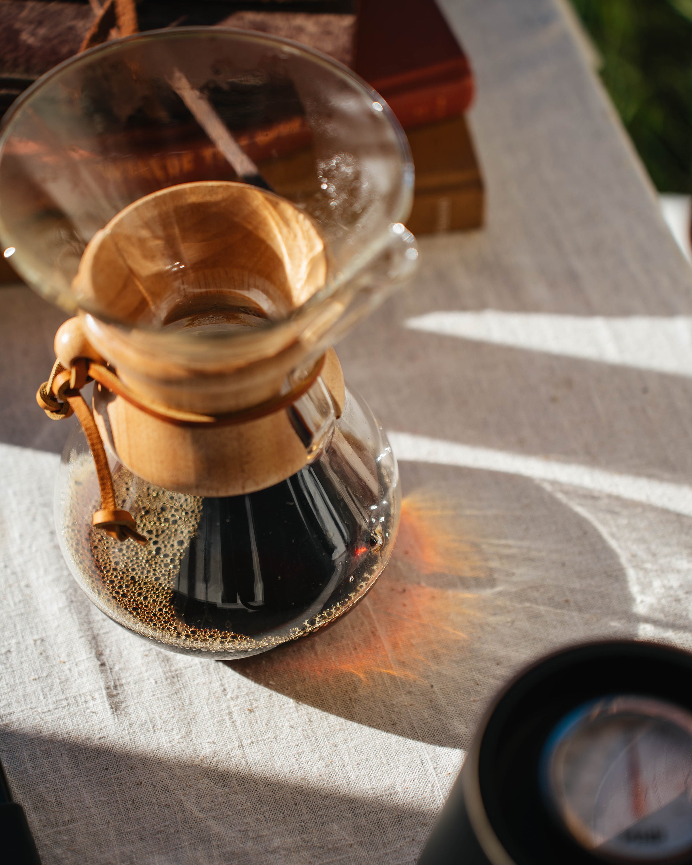 Pouring a Chemex brew outdoors in golden light