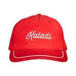 Red corduroy hat with embroidered white Kaladi script