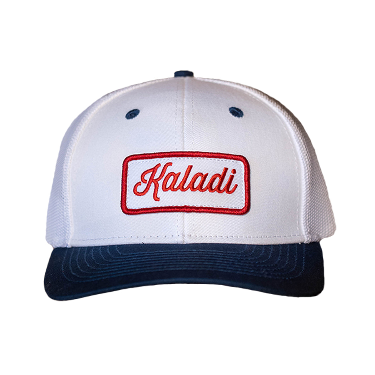 White trucker hat with red Kaladi patch and navy brim